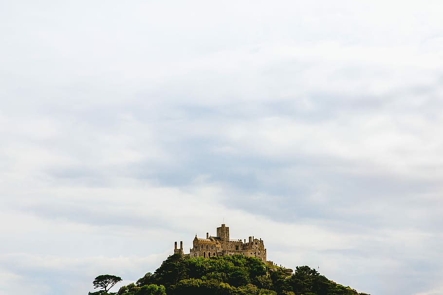 concrete castle on top of mountain, brown concrete castle under white sky HD wallpaper