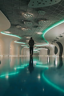 person walking in building, person in grey hoodie walking in middle of room HD wallpaper
