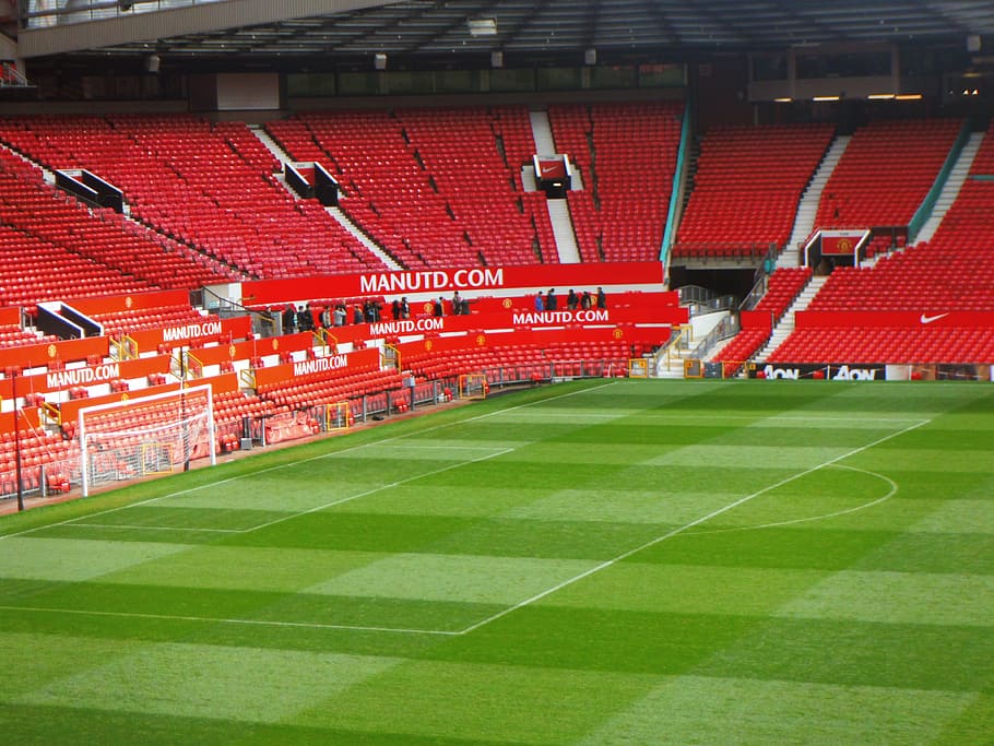 soccer stadium with red bleachers, old trafford, manchester united