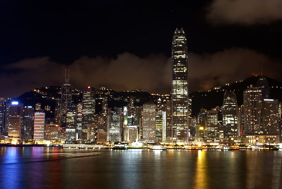 landscape of high rise buildings under black sky, hongkong HD wallpaper