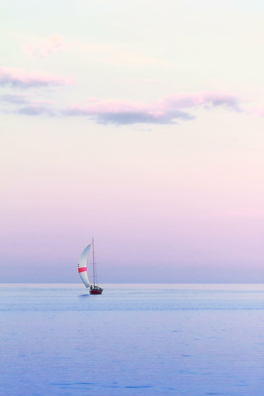 sailboat at the center of body of water, dusk, vertical, summer HD wallpaper