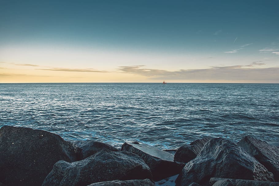 rock formation beside ocean during daytime, blue body of water during daytime HD wallpaper