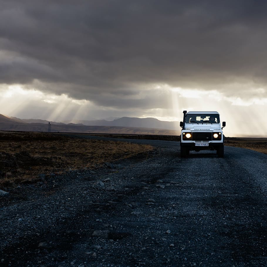 white SUV on road under gray sky during golden hour, photography HD wallpaper