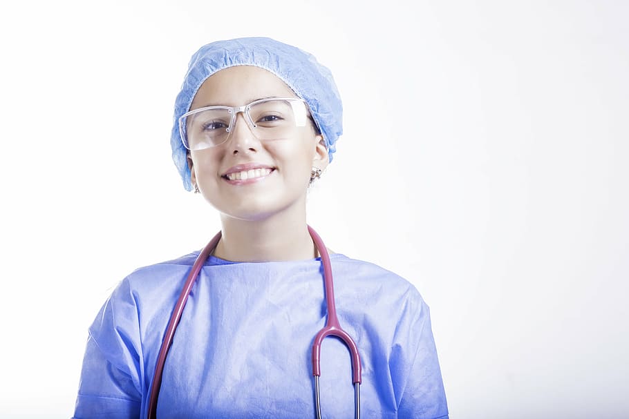 female doctor wearing glasses and blue medical dress, nurse, medicine