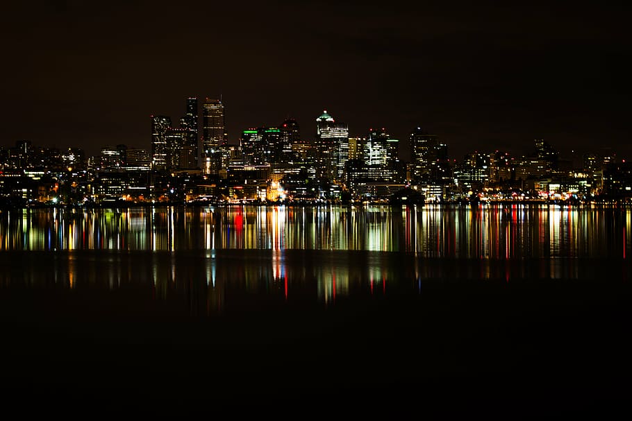city, cityscape, lights, night, reflection, sea, skyline, water HD wallpaper