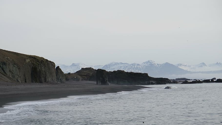 mountains by the sea, daytime, white, beach, near, rock, formations HD wallpaper