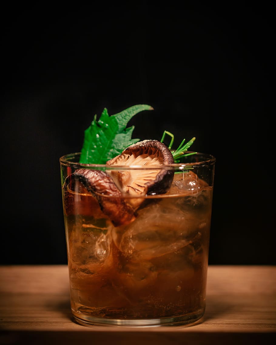 brown mushroom on drinking glass, iced drink with green herb and mushroom top HD wallpaper
