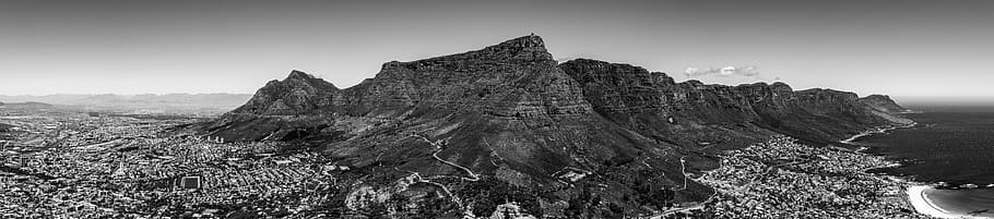 grayscale photo of city near mountain, cape town, camps bay, south africa