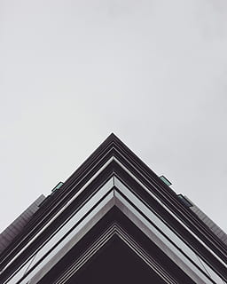 architectural photography of edge of building, brown and white establishment HD wallpaper