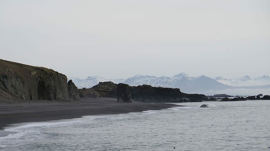 rock formation surrounded by boy of water, landscape photography of seashore HD wallpaper
