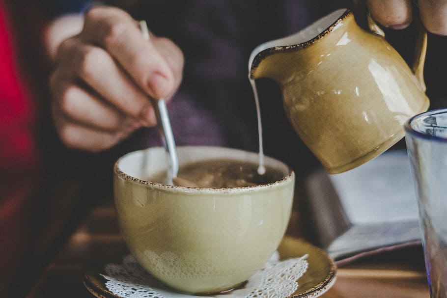 brown ceramic mug, person pouring cream on teacup, drink, jug HD wallpaper