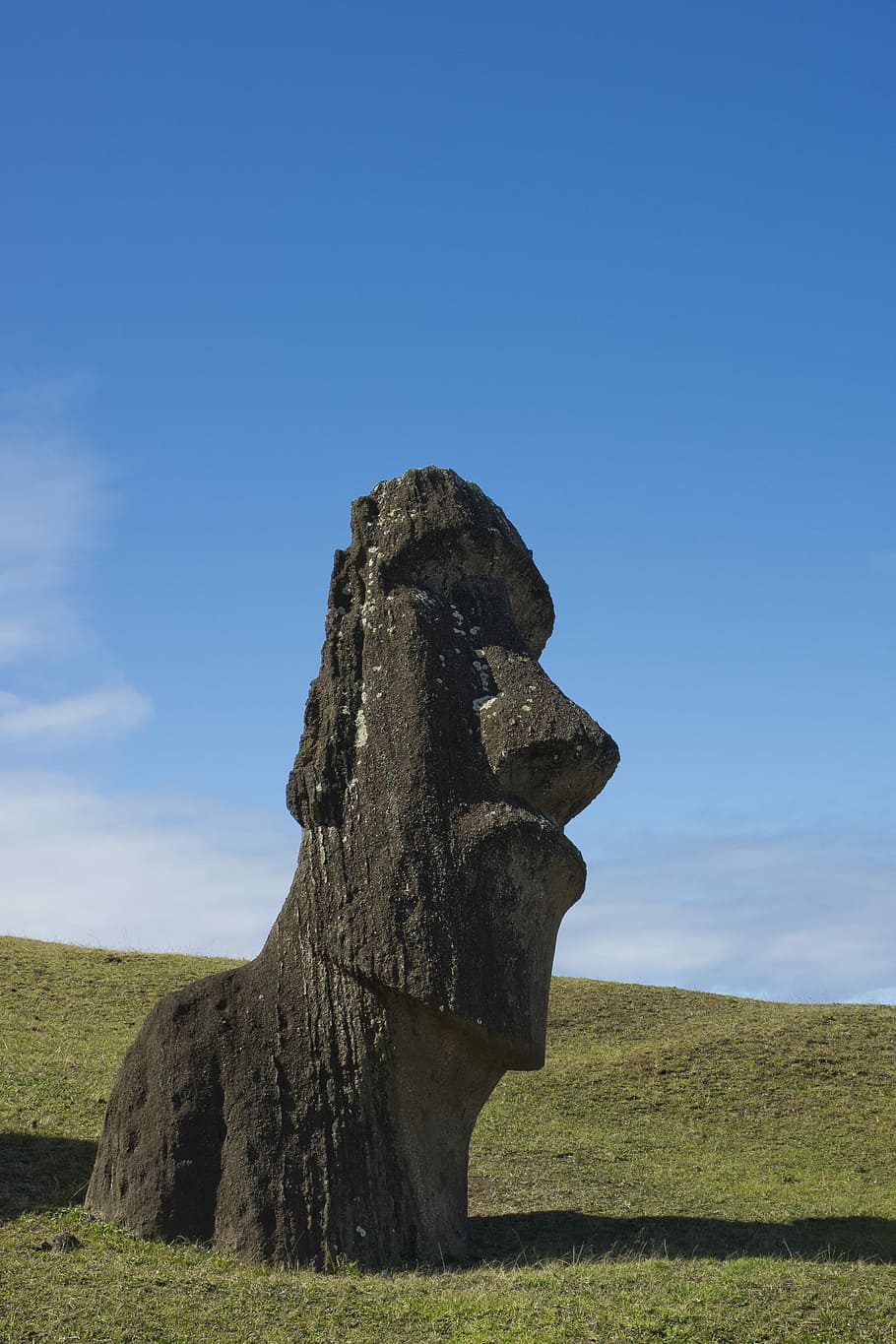 Stone Faced, blak stone landmark, sculpture, monument, sky, blue