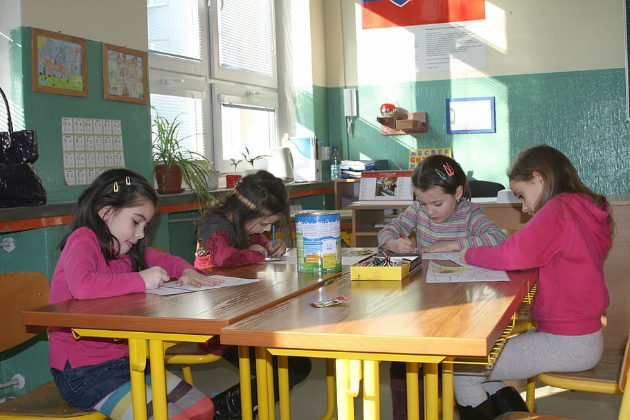 girls holding coloring materials while sitting on chair, school HD wallpaper