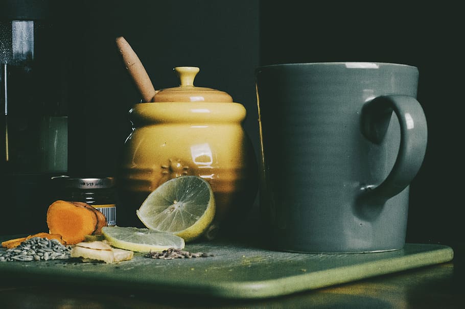 beige ceramic jar beside grey ceramic pitcher and sliced lemon fruit, gray ceramic mug beside yellow and brown ceramic jar HD wallpaper