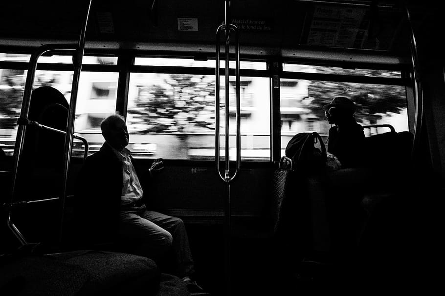 grayscale photo of several people on moving train, two people at train HD wallpaper