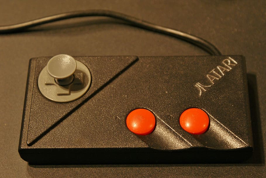 black Atari game controller, corded, video games, gaming, objects