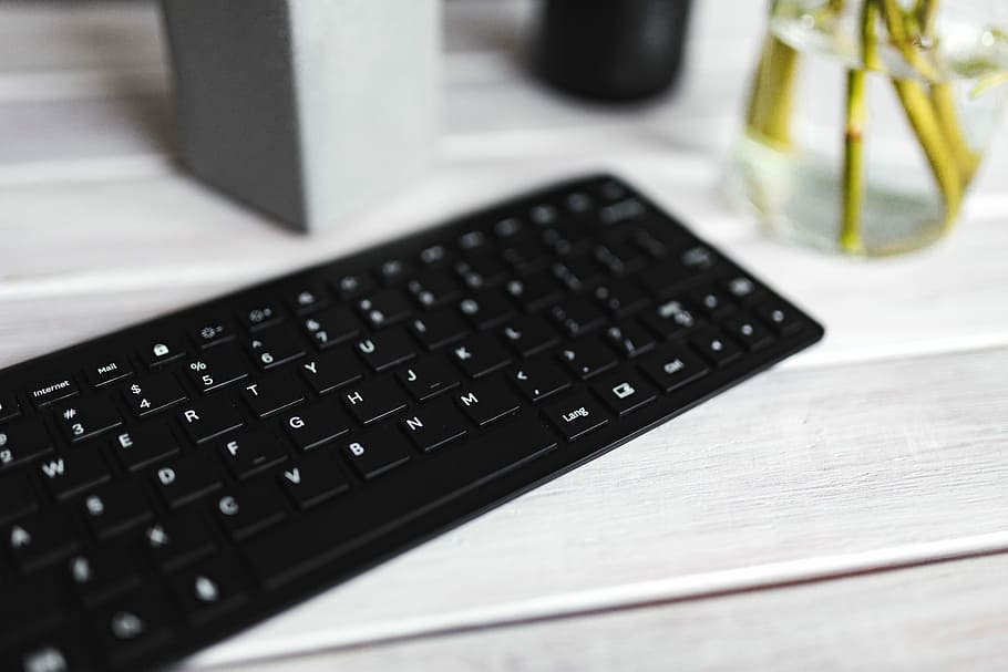 Black keyboard with pencils on a white table, bottle, plant, computer, HD wallpaper