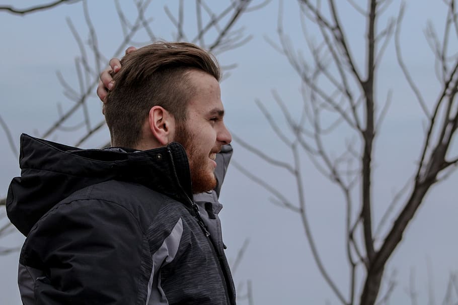 man standing near bare tree, person, profile, coat, jacket HD wallpaper