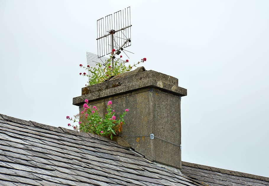gray metal signal antenna on chimney, fireplace, ireland, schull