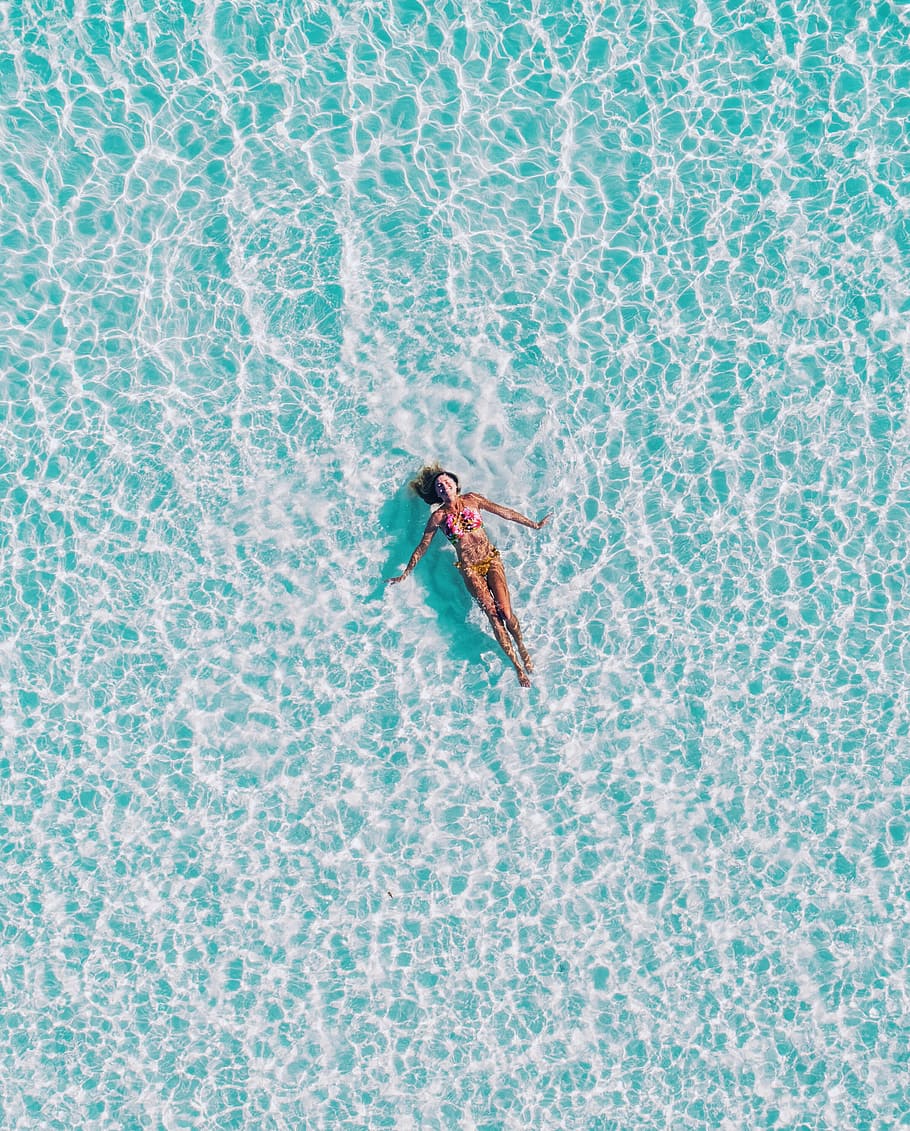 woman floating on body of water, Lost in the Turquoise, summer HD wallpaper