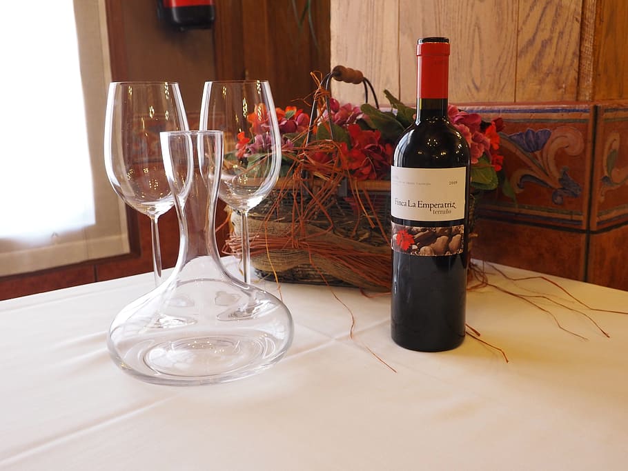 wine glass bottle next to clear glass wine container and wine glasses on table HD wallpaper
