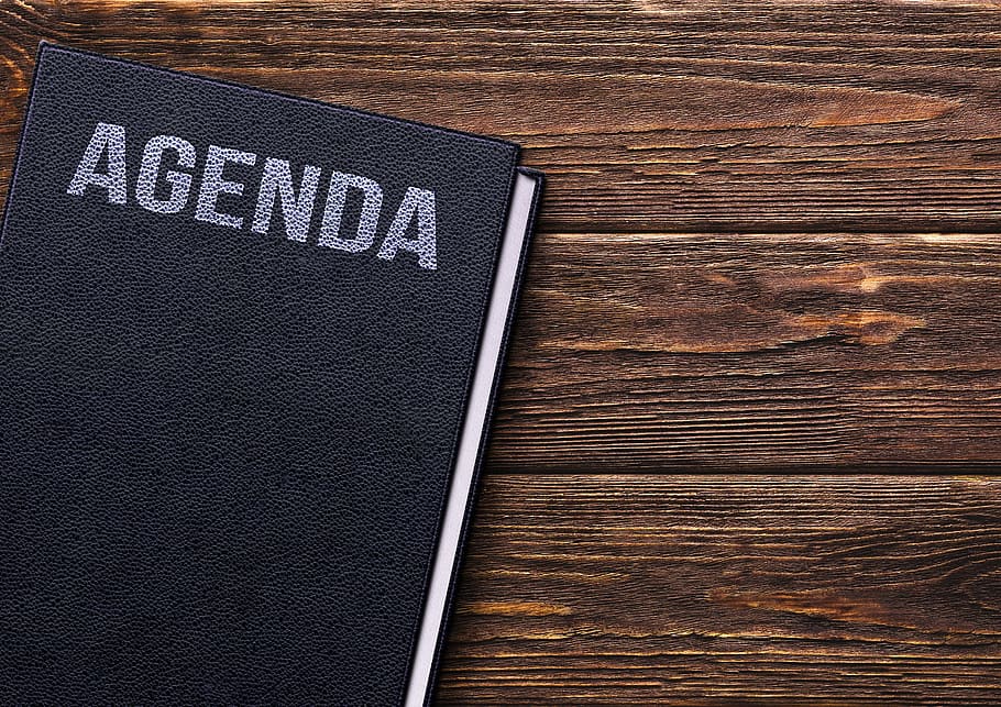 Agenda book on brown wooden surface, table, notes, notebook, wooden table