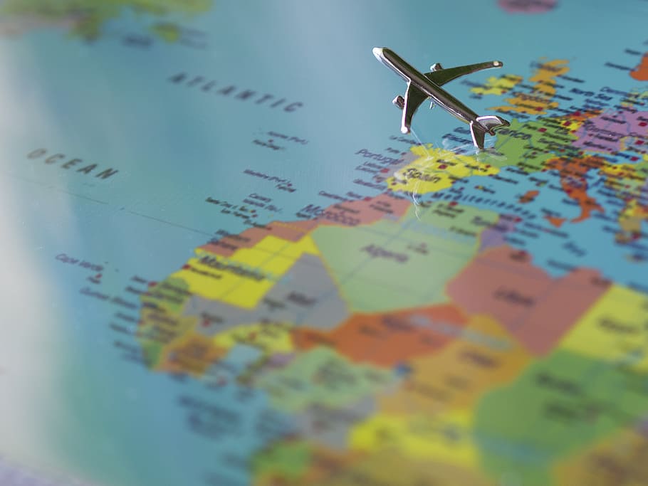 airliner scale model flying over map selective focus photography, HD wallpaper
