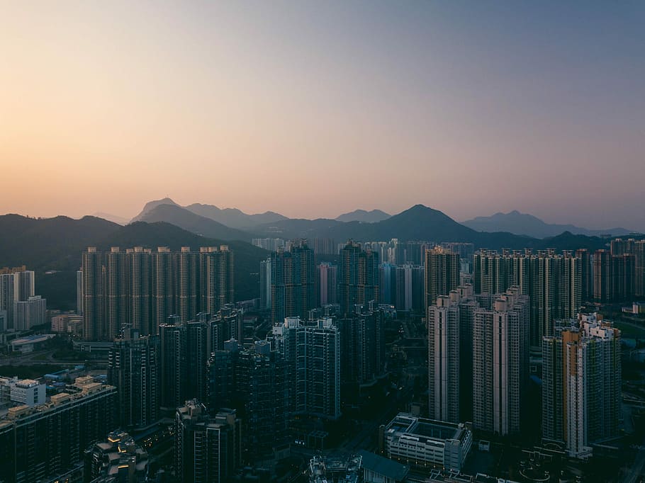 city buildings under orange sunset, aerial photography of city during sunset HD wallpaper