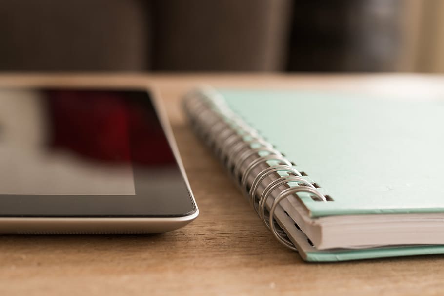 shallow focus photography of teal spiral notebook, ipad, technology HD wallpaper