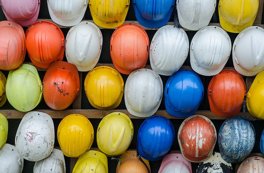 assorted color of hardhats piled on brown wooden rack, lot, construction, HD wallpaper