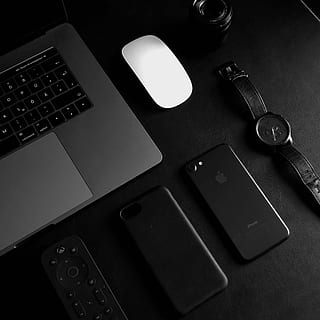 jet black iPhone 7 beside analog watch, round black chronograph watch beside black iPhone 7 HD wallpaper