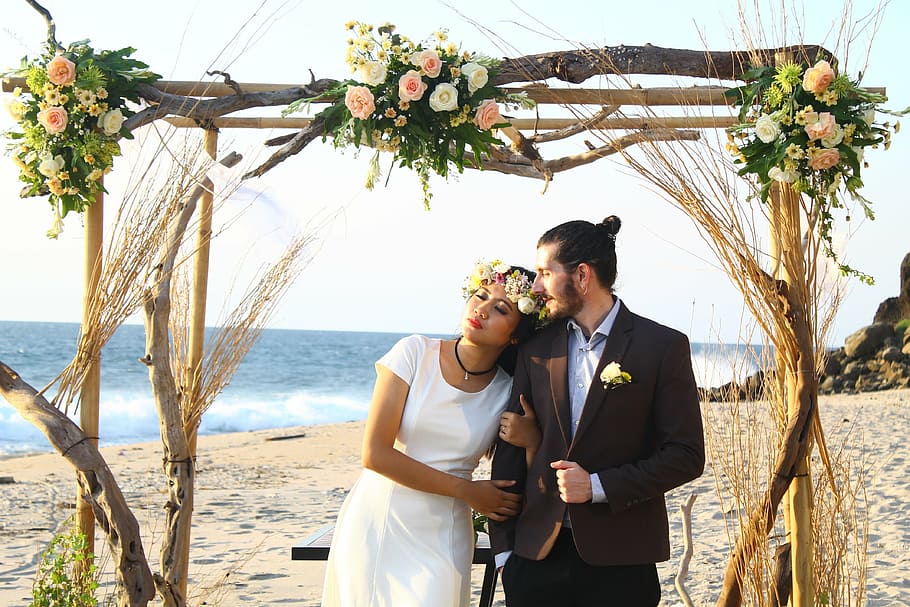 photo of bride and groom on seashore during daytime, wedding