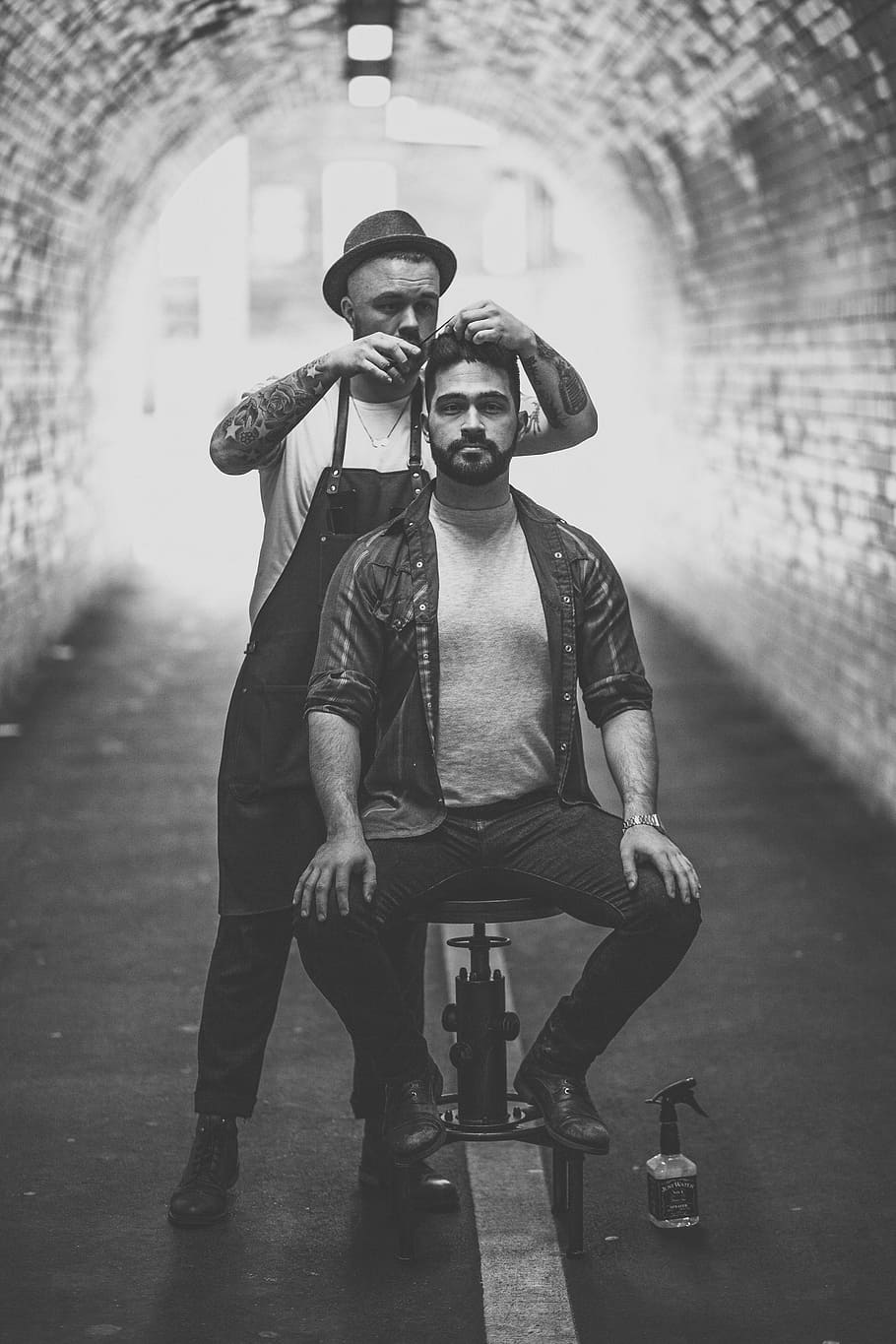 barber cutting mans hair inside tunnel, grayscale photo of two man inside dome road, HD wallpaper
