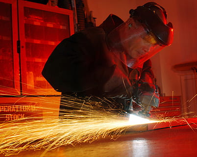 person wearing black jacket while holding power tool, man, working HD wallpaper