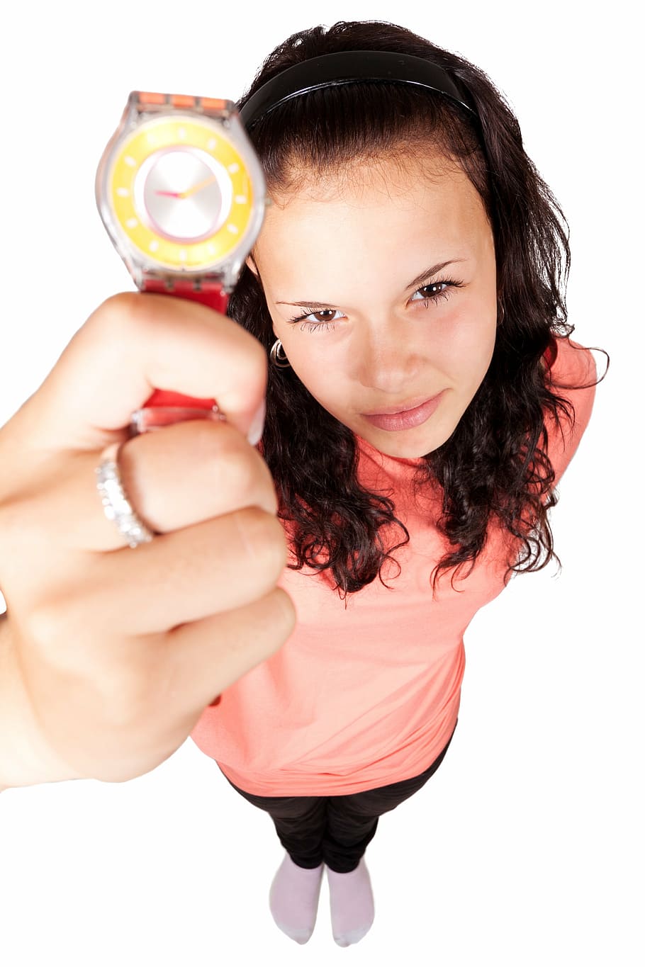 woman in pink top holding round silver-colored analog watch with red strap HD wallpaper