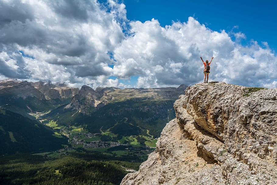 person standing beside cliff, mountain top, achieve, achievement