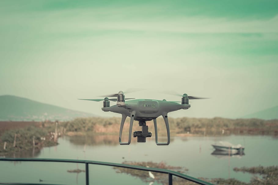 flying white drone quadcopter during daytime, gray and black quadcopter drone HD wallpaper