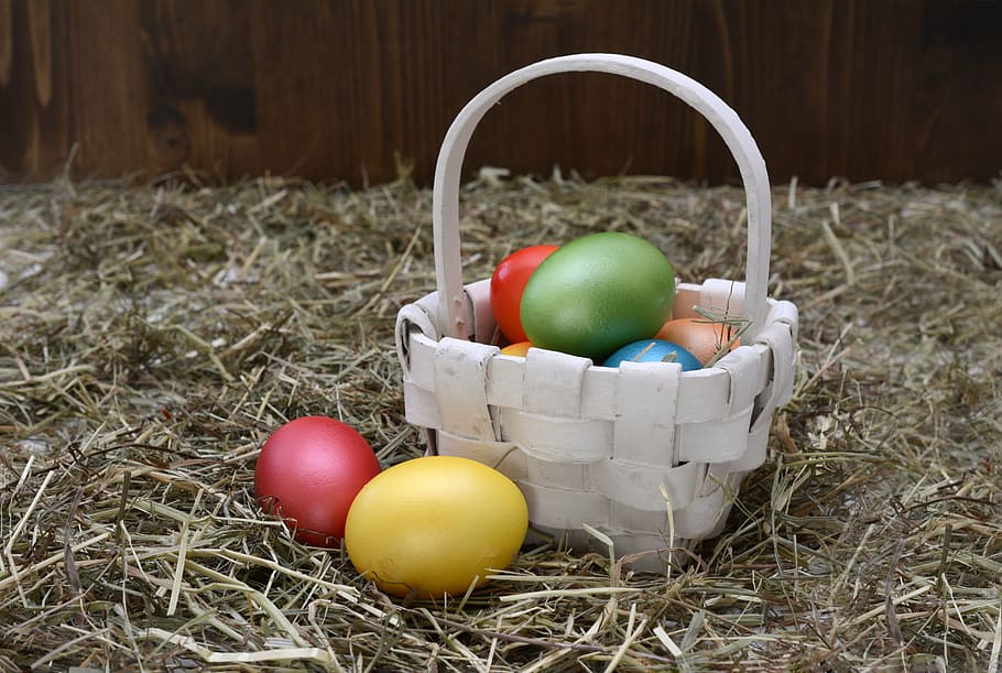 white wicker basket and easter eggs, easter nest, decoration