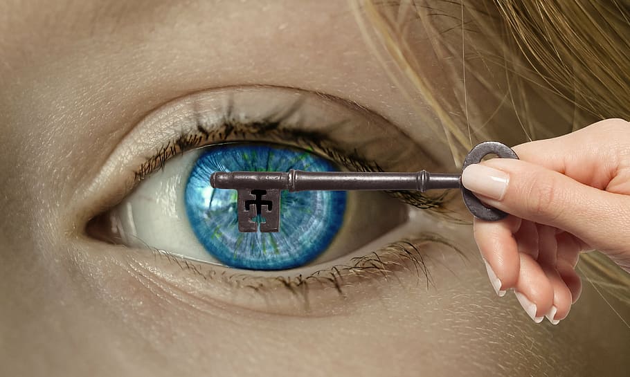 person holding key covering person's left eyeball, hand, open eye HD wallpaper
