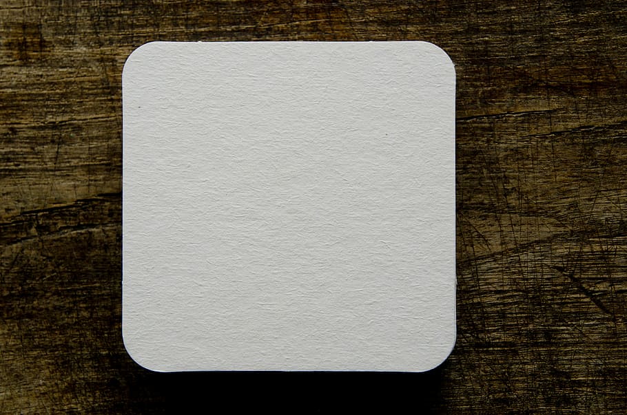 square white trinket, beer coasters, blank, drink, table, paper