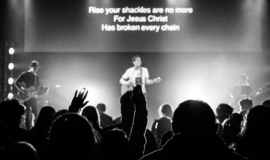 man standing on stage and playing guitar, grayscale photography of band performing on stage HD wallpaper