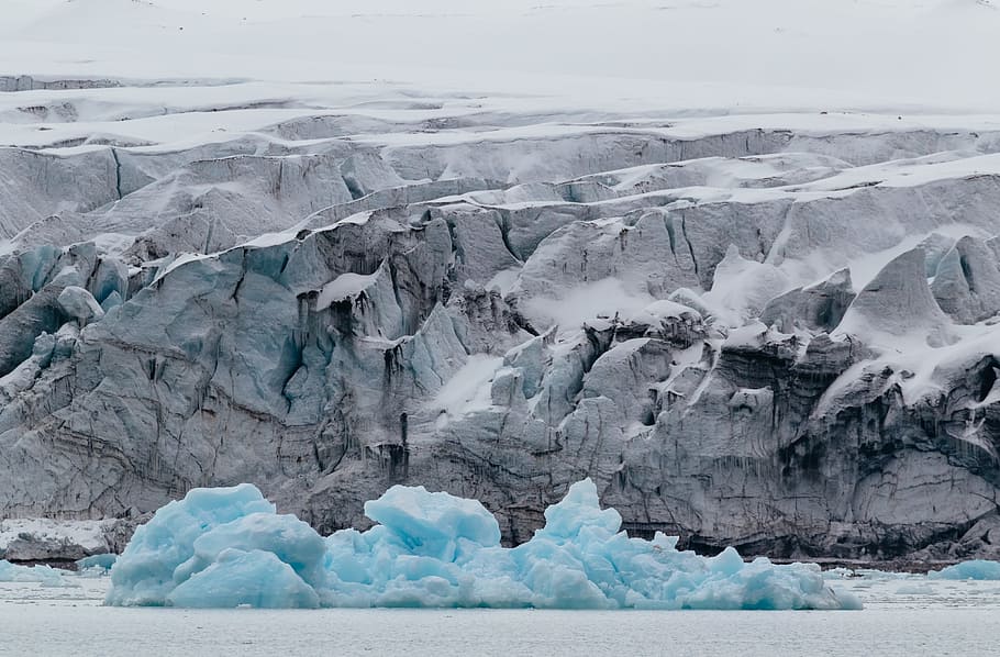 landscape photo of ice glacier, iceberg near cliff, Svalbard