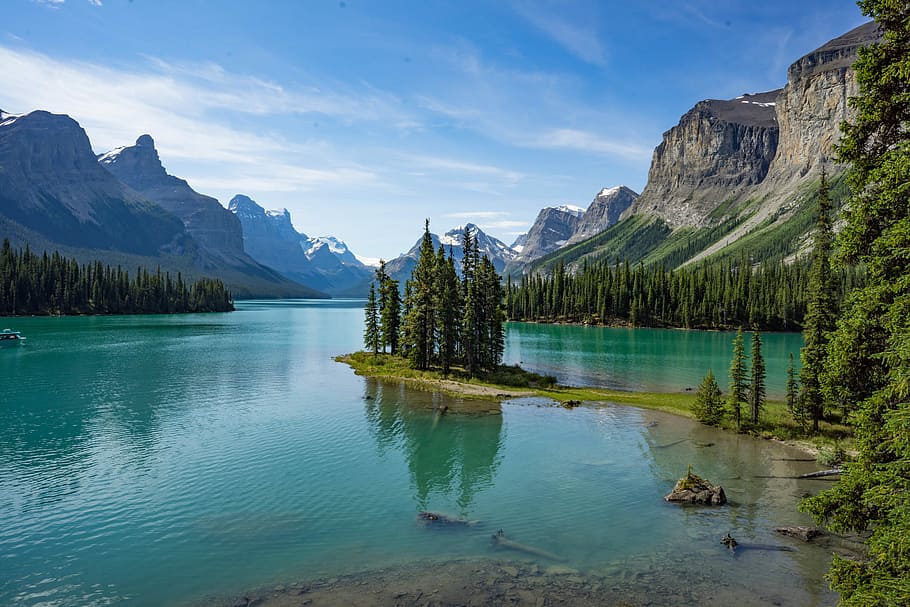 green pine trees near lake in forest during daytime nature photography, body of water surrounded by trees and mountains HD wallpaper