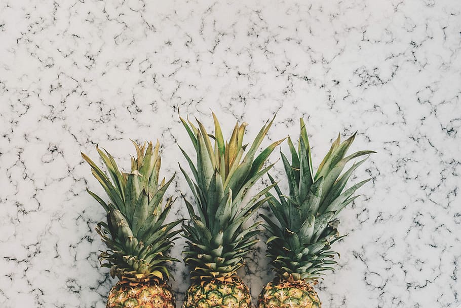 three yellow pineapple fruits on white surface, three pineapple fruits HD wallpaper