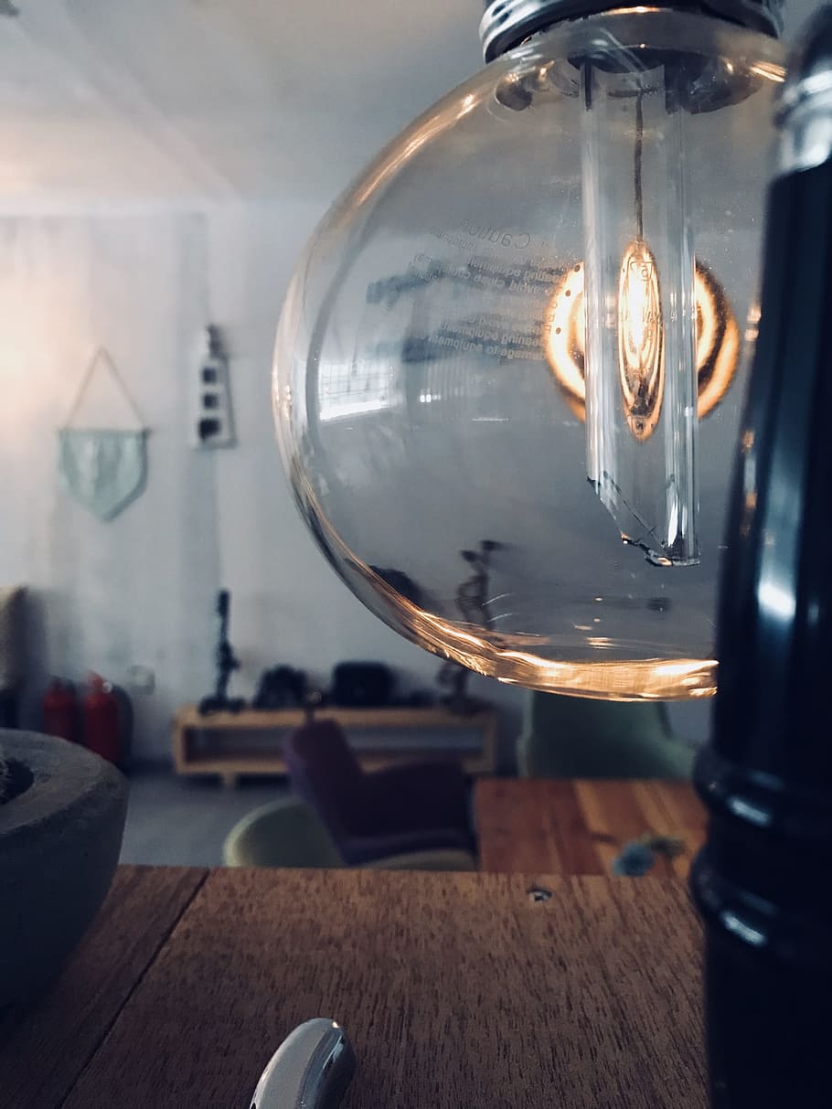 Clear Glass Lamp Near Brown Wooden Surface, blur, bulb, close-up HD wallpaper