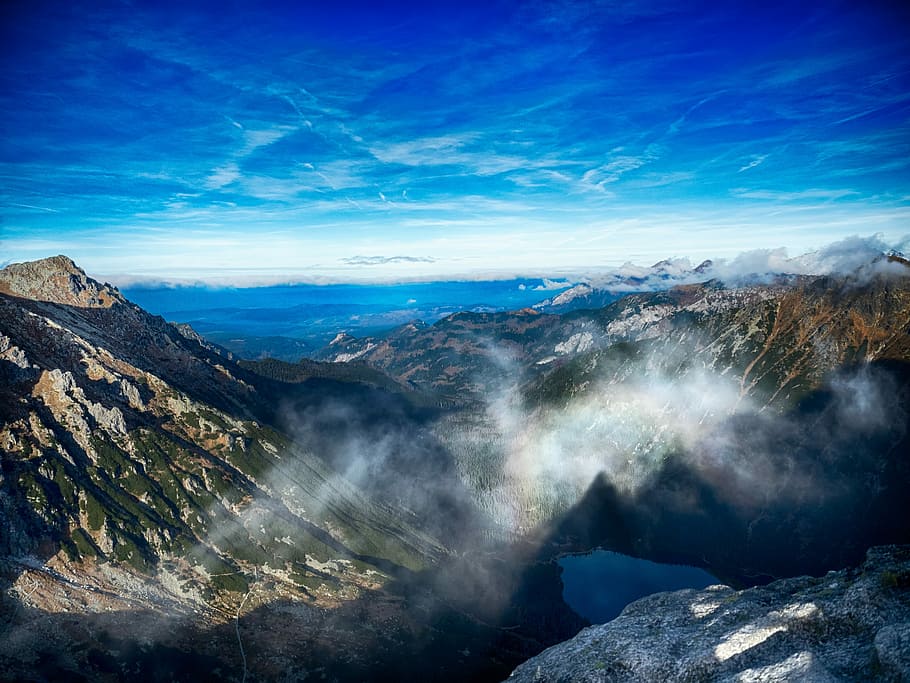 aerial view of mountains with low clouds during daytime, mountain covered by fog HD wallpaper