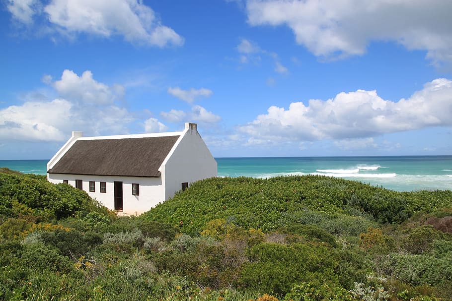 white concrete house under white clouds and blue sky, sea, wave HD wallpaper