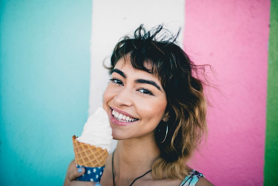 woman holding ice cream during daytime, woman eating ice cream HD wallpaper