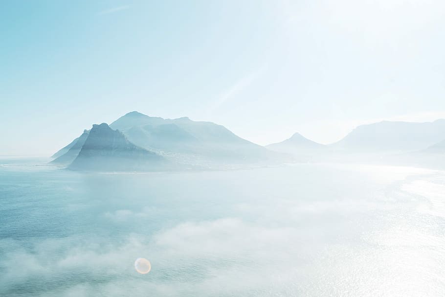 bird's-eye view photography of mountain, photo of mountains on body of water HD wallpaper