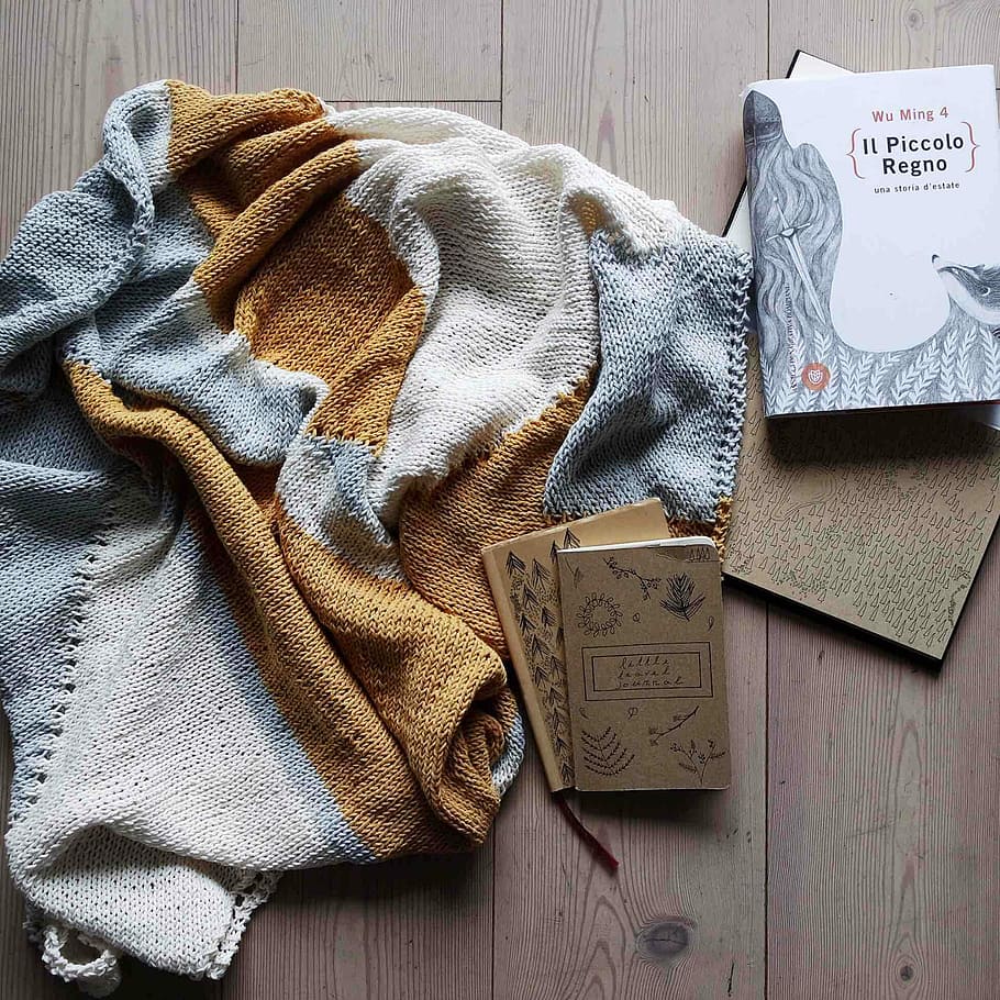 brown and gray knit textile, three assorted-title books beside scarf HD wallpaper